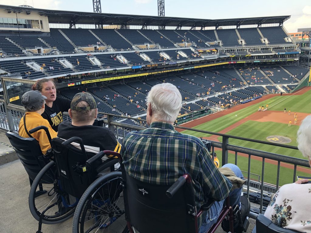 RP Home residents sitting at Pirate's game