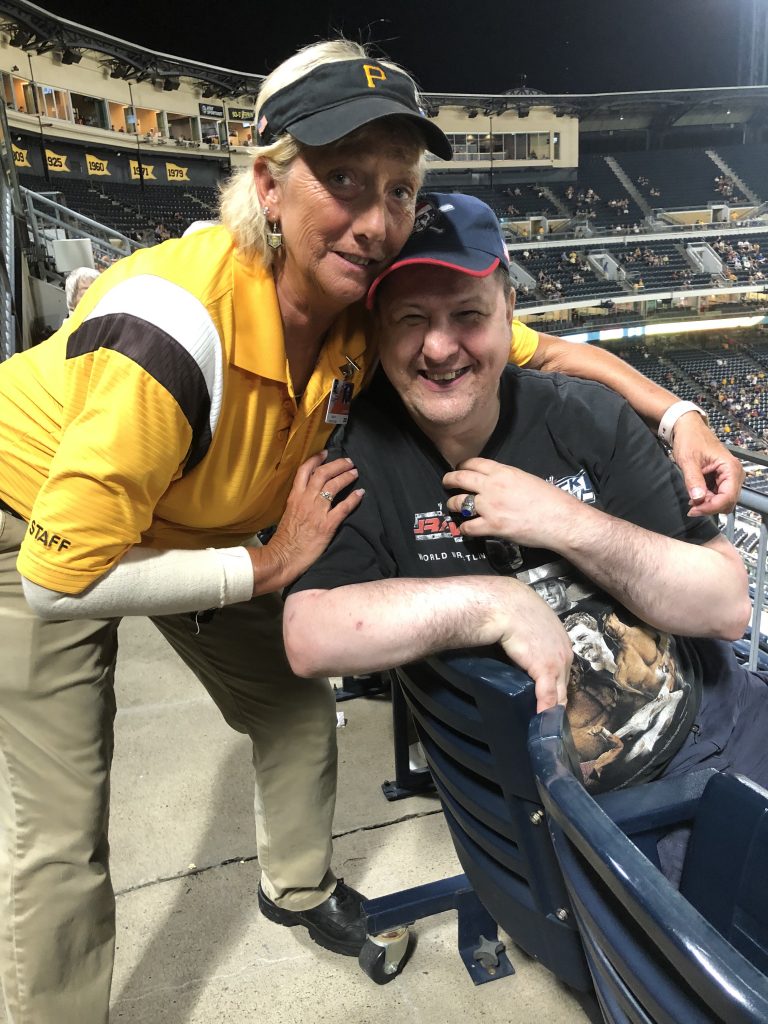 RP Home resident at Pittbsurgh Pirate's Game getting hugged by a female usher